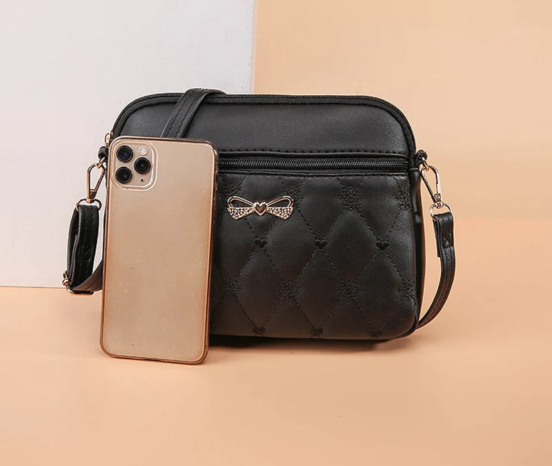 Nyankomst Enkla axelväskor för kvinnor Broderi Hjärta Crossbody-väska Kvinnlig Läder Svart Handväska Liten Messenger Bag